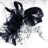 Black and silver couples masquerade masks with feathers, rhinestones, and elegant Venetian details.