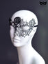 Black and silver lace masquerade mask with gothic detailing for women’s prom, ball, or Halloween party.