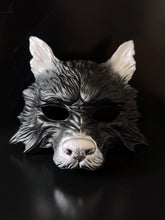 Black and silver wolf masquerade mask with sculpted details for costume and cosplay events.