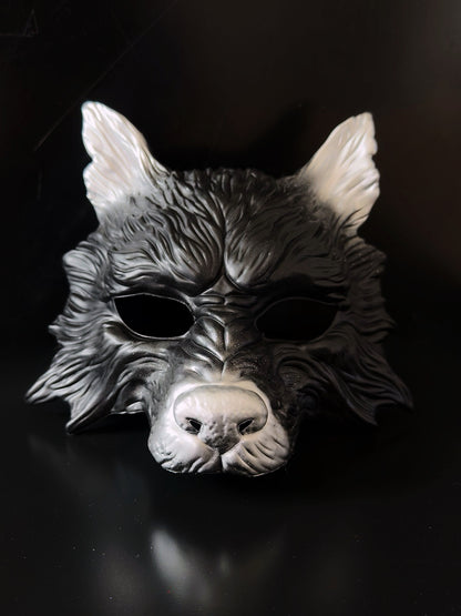 Black and silver wolf masquerade mask with sculpted details for costume and cosplay events.