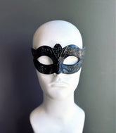 Black Venetian masquerade mask for men with embossed design for party and costume events.
