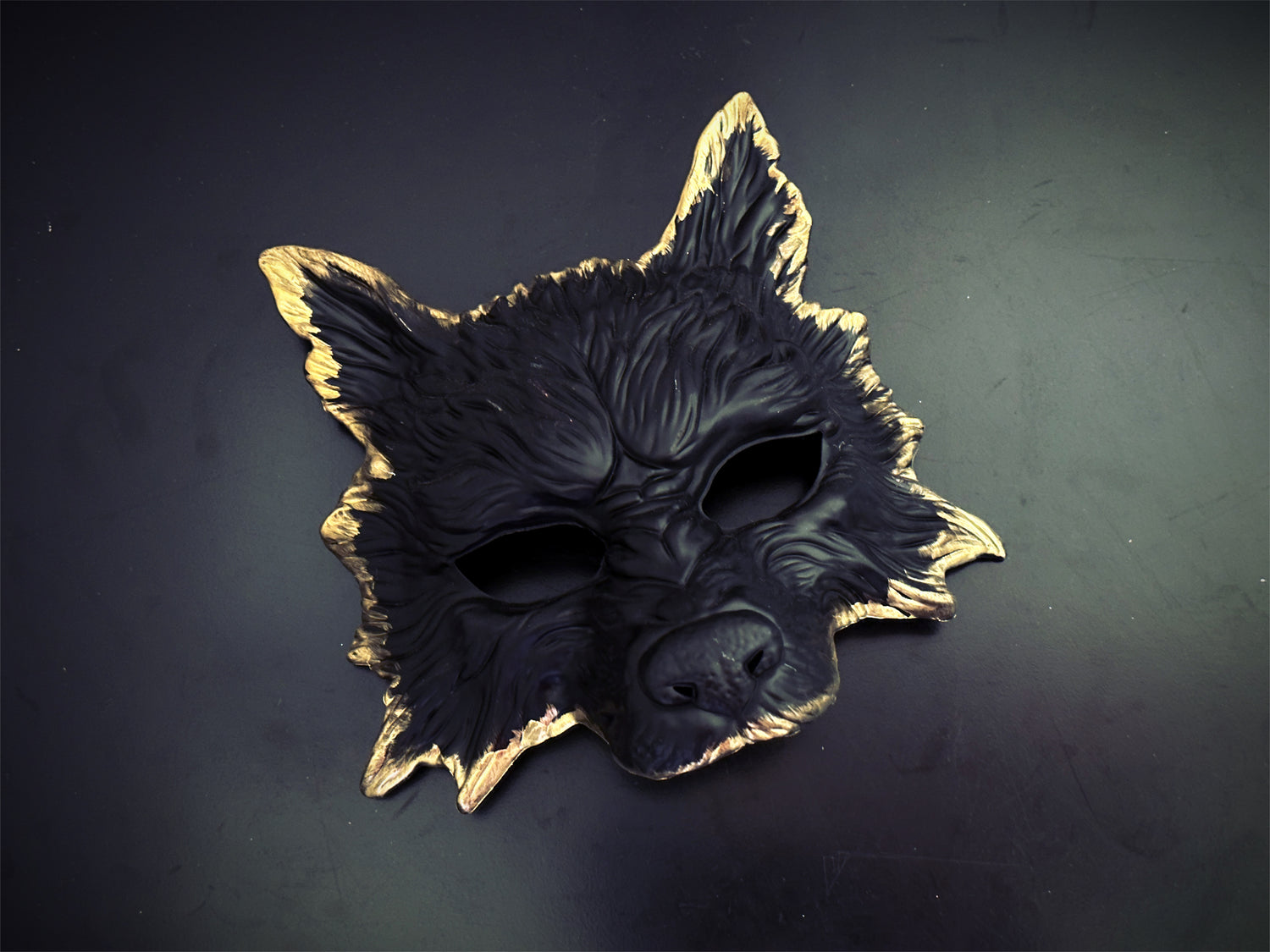 Black wolf mask for men featuring bold texture and animal shape for a masquerade ball or Halloween costume
