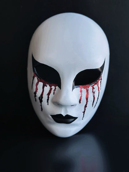 Bloodveil Hollow white full-face Halloween mask with black eye details, black lips, and red drip accents for gothic costume styling.