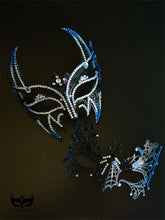 Blue and black couples masquerade mask set with a horned rhinestone masquerade mask and a spiderweb-style eye mask for gothic formal events.
