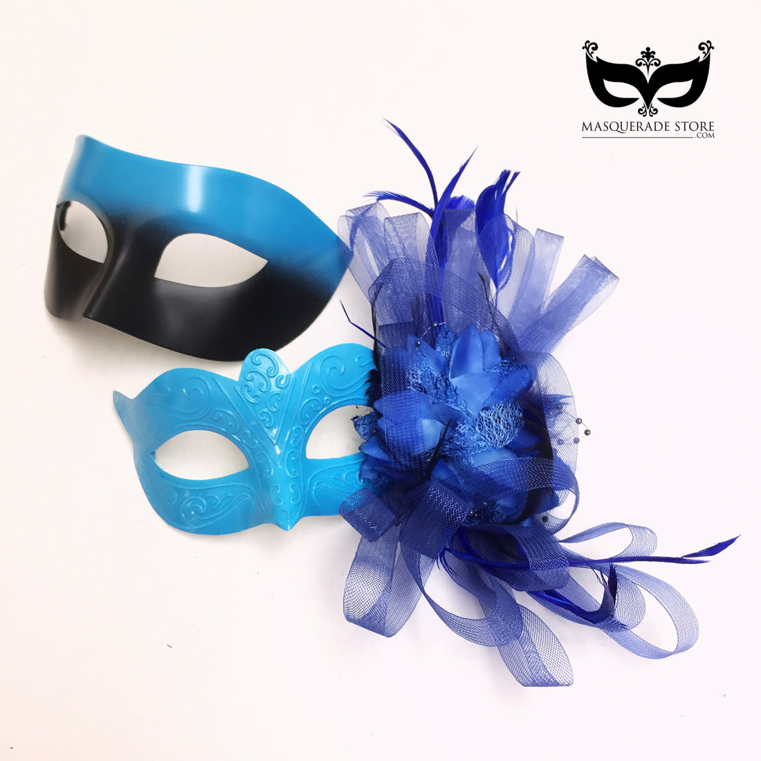 Blue couples masquerade mask set with sleek men’s gradient mask and feathered women’s mask decorated with tulle and floral accents.