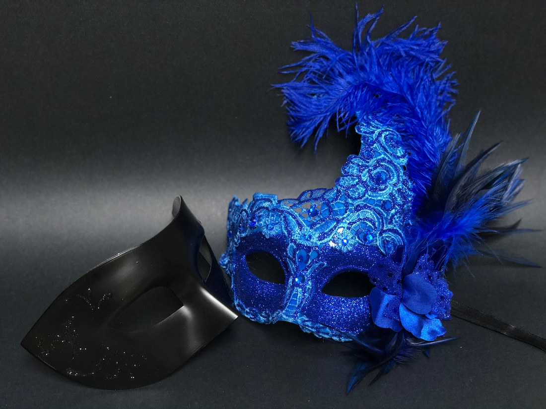 Elegant black couples masquerade mask set with feathered women’s mask and men’s classic mask, available in blue.
