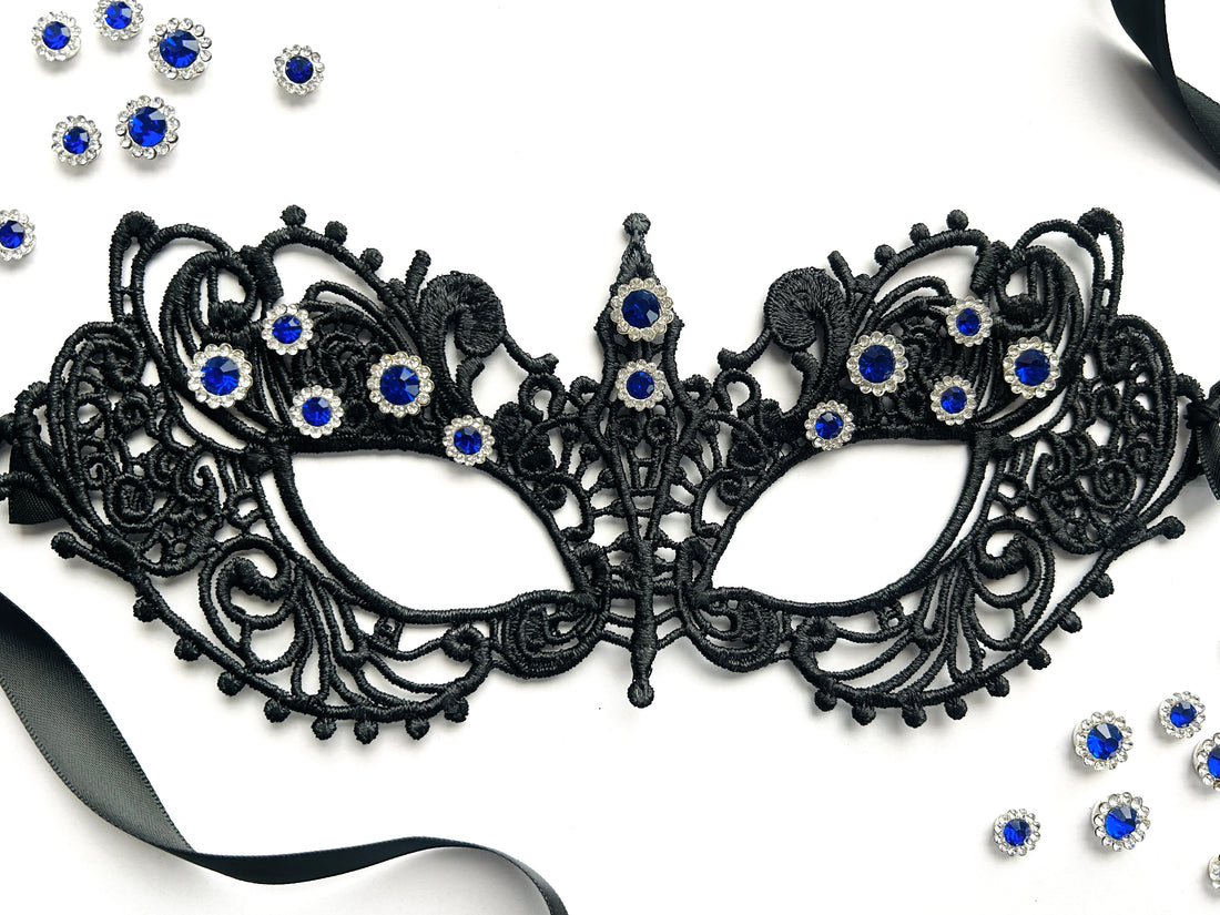 Black lace masquerade mask with sapphire blue rhinestones for gala parties and Venetian formal events.