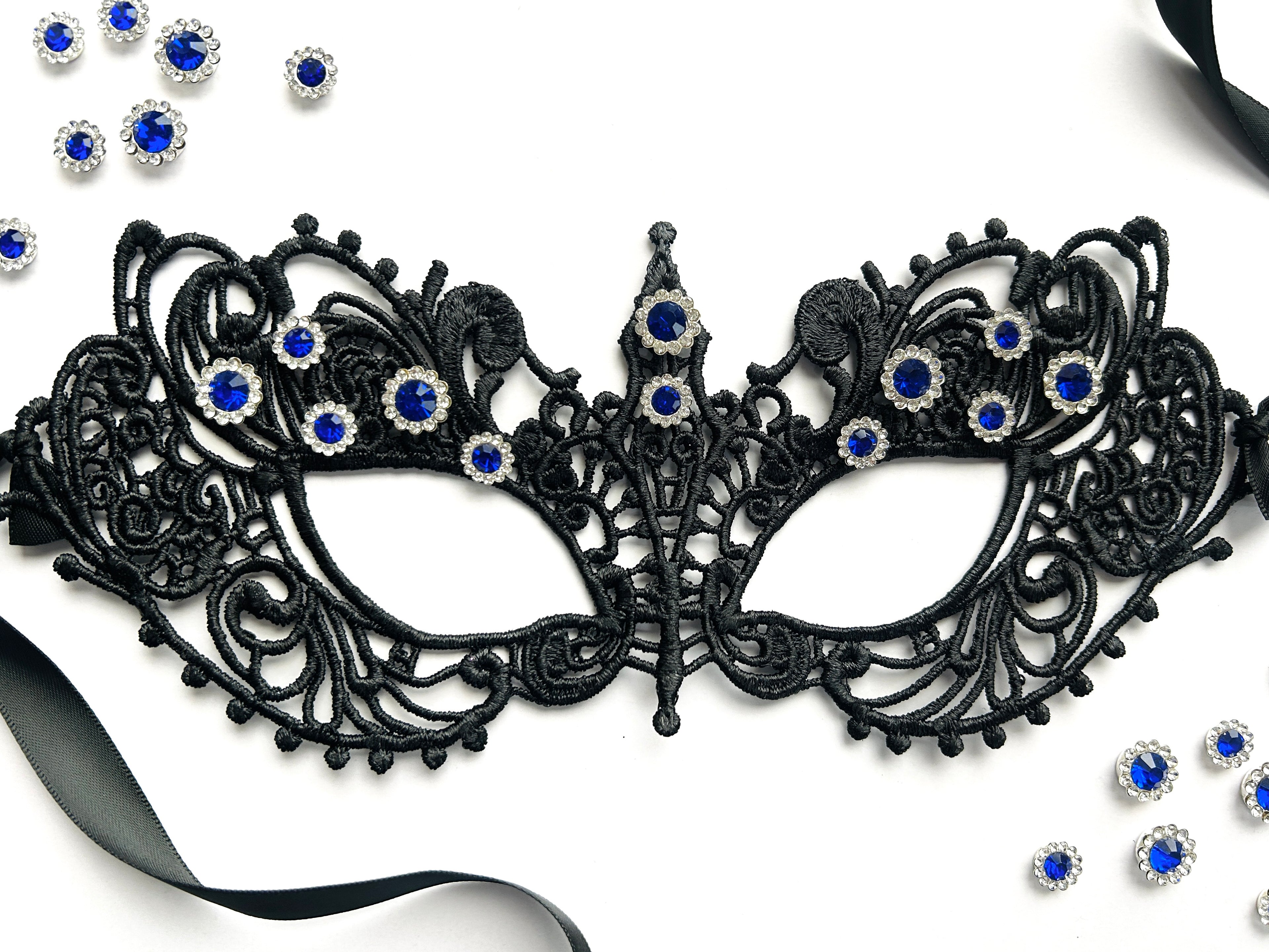 Black lace masquerade mask with sapphire blue rhinestones for gala parties and Venetian formal events.