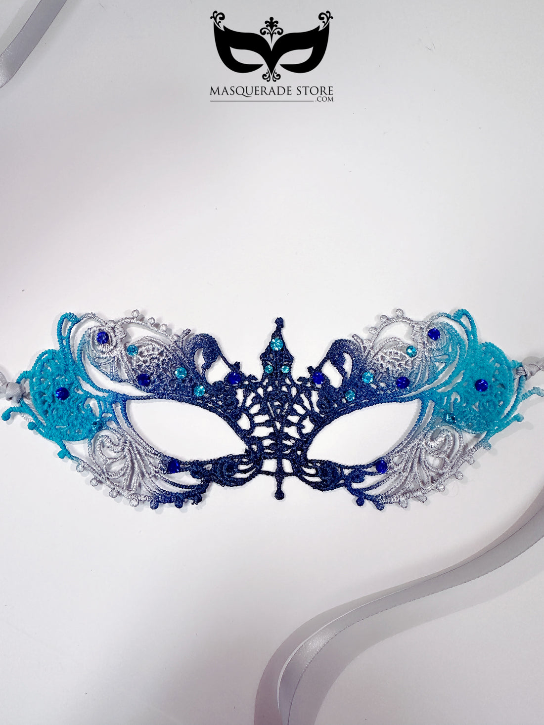Elegant blue and silver lace masquerade mask with rhinestone details for prom and winter parties.