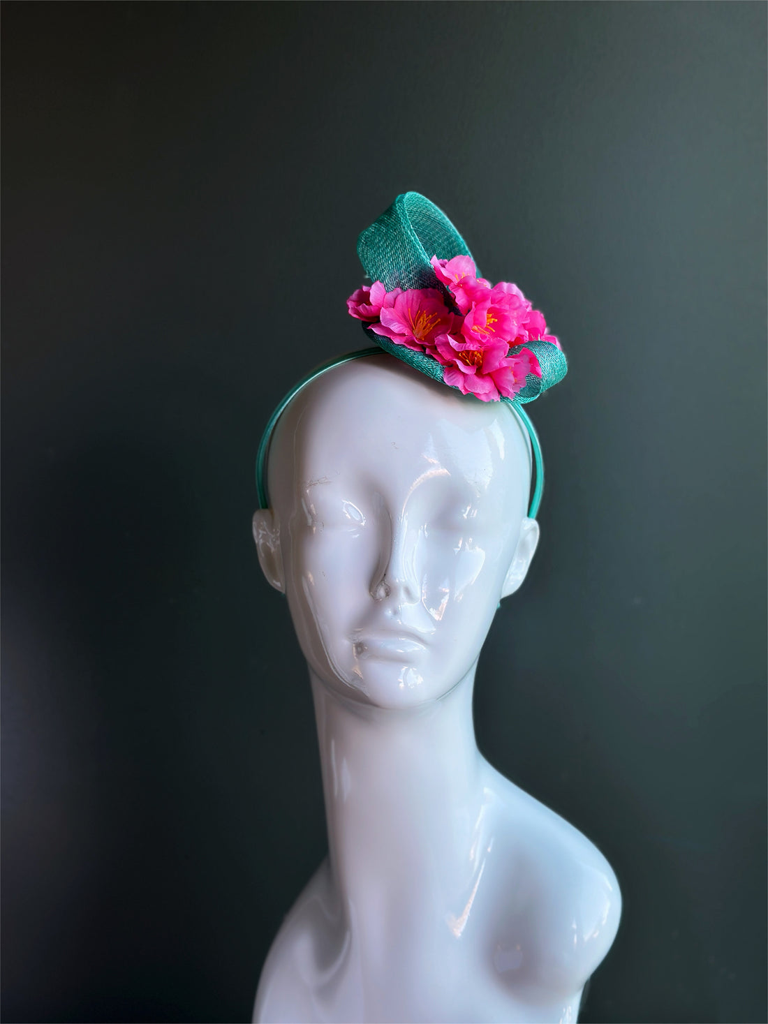 Bold pink floral teal fascinator headband for Derby events, weddings, and spring occasions.