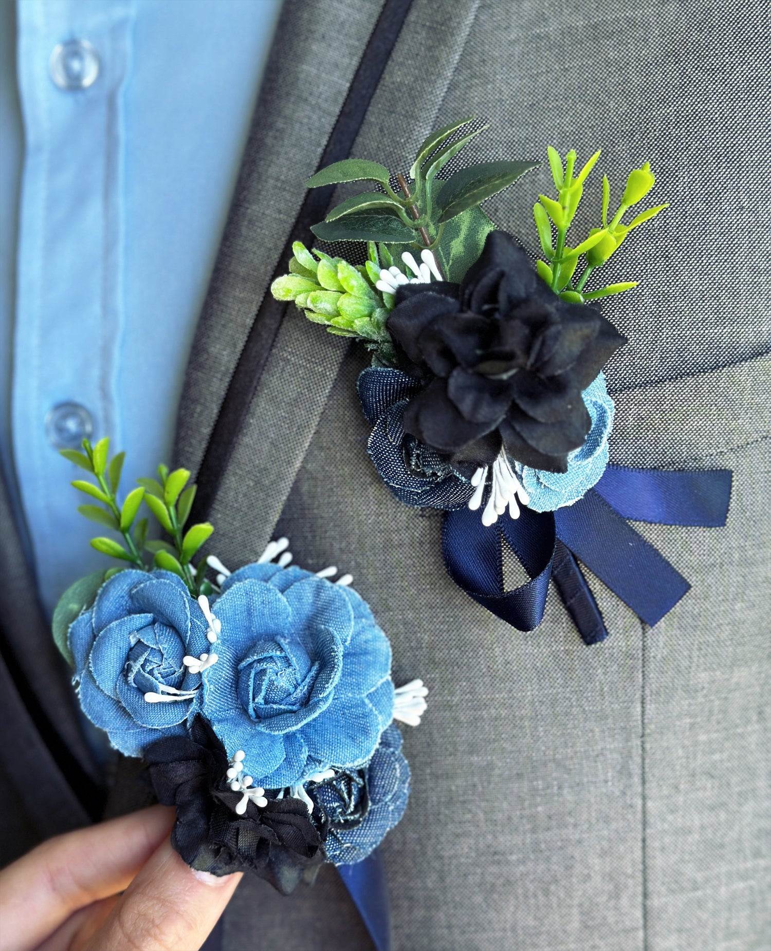 Blue and black floral boutonniere and corsage set for prom, weddings, and formal evening events.
