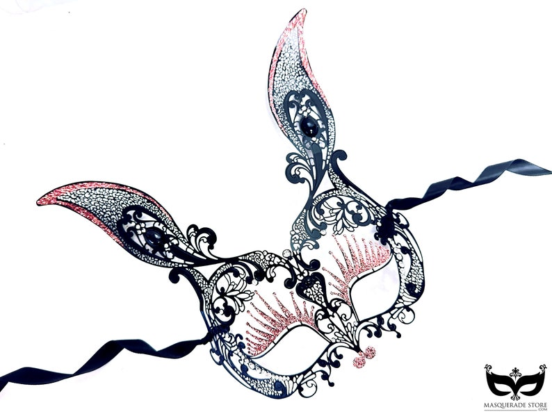 Black bunny ears masquerade mask with pink glitter filigree design.