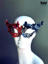 Red and blue butterfly masquerade mask with 3D butterfly accents for women, perfect for Venetian balls and costume parties.