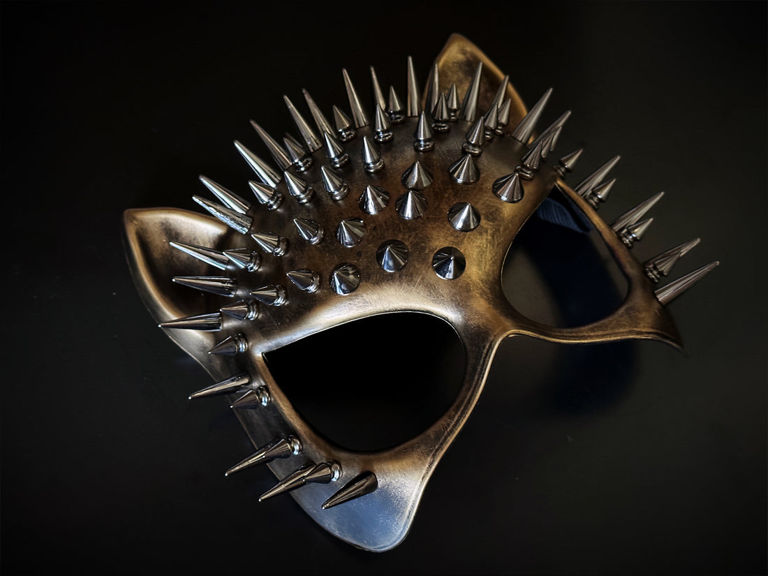 Spiked cat masquerade mask in copper with 3D cone studs and feline ear shape, ideal for punk, gothic, or costume events.