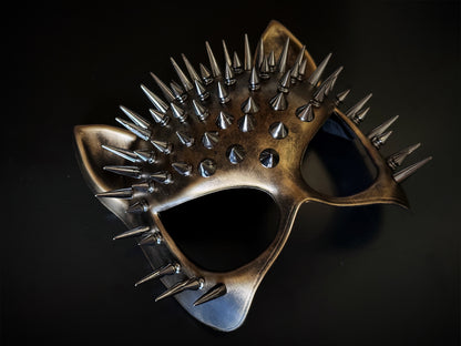 Spiked cat masquerade mask in copper with 3D cone studs and feline ear shape, ideal for punk, gothic, or costume events.