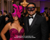 Pink Venetian couples masquerade mask set with dramatic feather plume women’s mask and black mask with pink glitter accents.