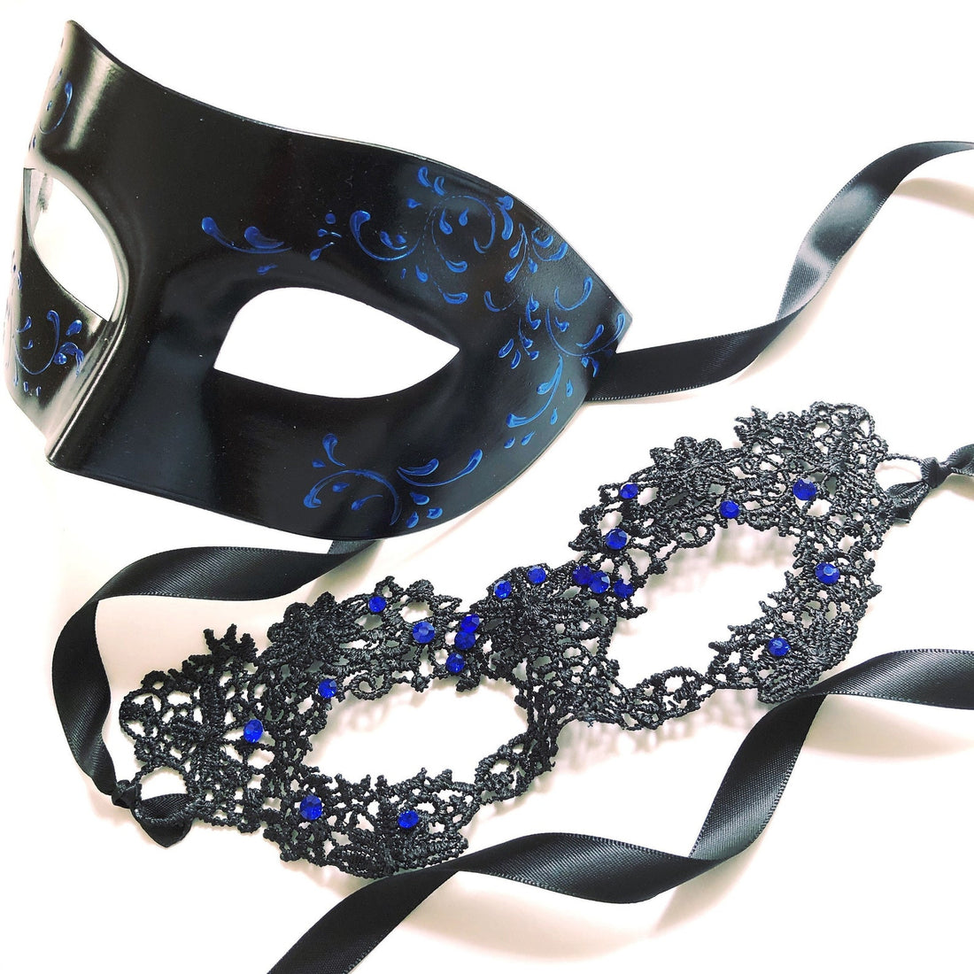 Elegant black masquerade couple set with blue embellishments and ribbon ties for formal occasions.