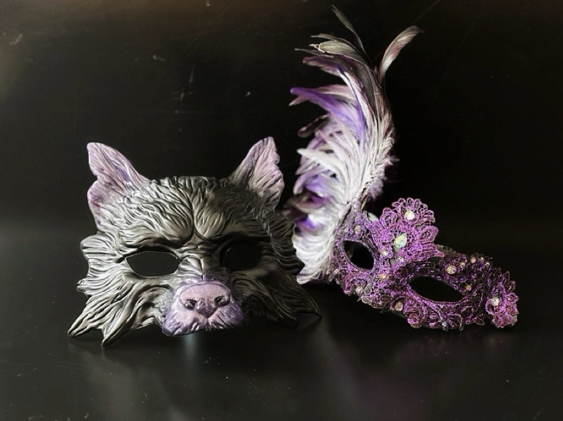 Couple masquerade mask set with wolf mask and purple lace feather mask for party and costume events.