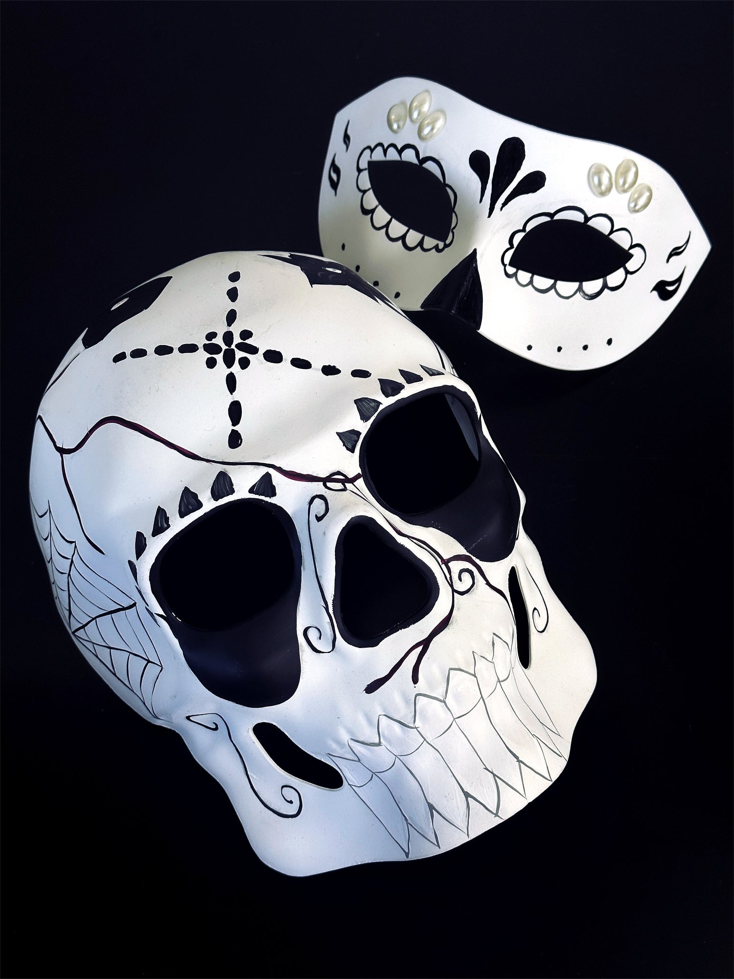 Couples day of the dead masquerade masks in black and white.