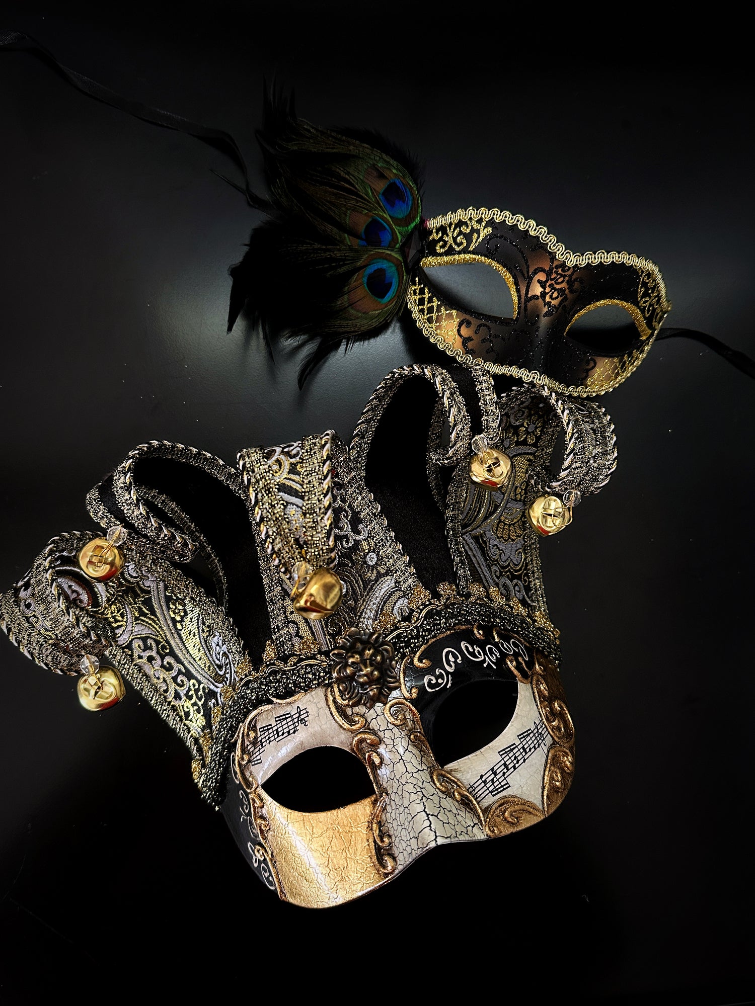 Black and gold Venetian couples masquerade mask set with jester mask and feathered mask, perfect for Mardi Gras, Carnival, Halloween, or masquerade ball.