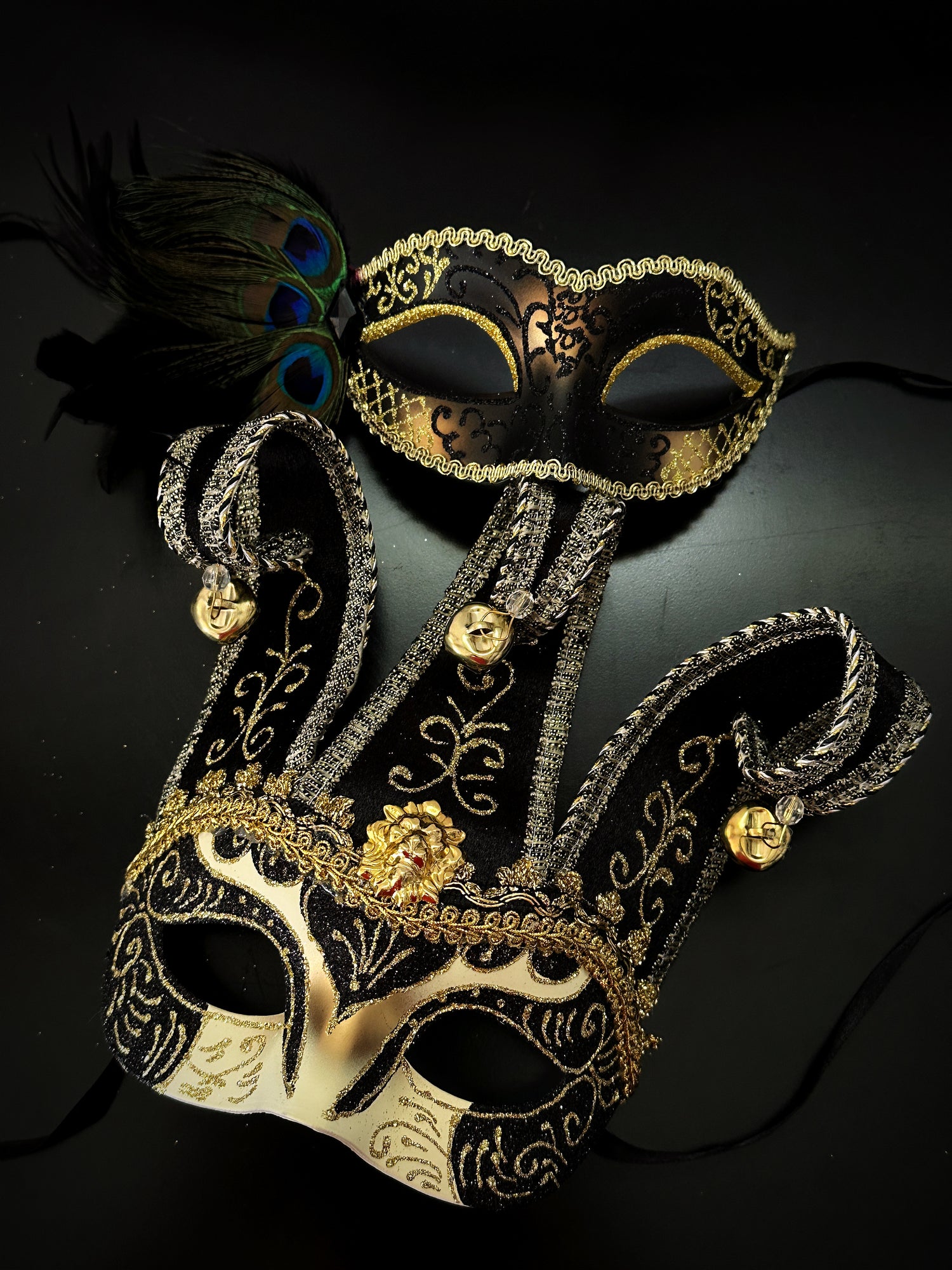 Black and gold couples masquerade mask set with Venetian jester mask and peacock feather mask, ideal for prom, Halloween, or masquerade ball.
