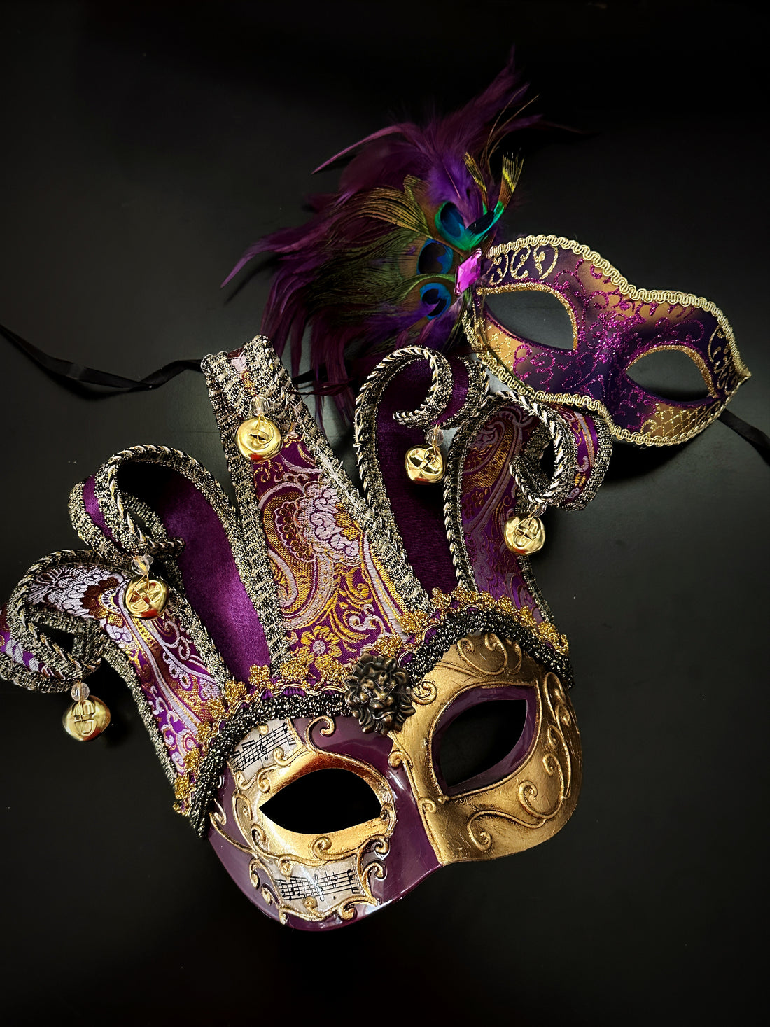 Purple and gold Venetian couples masquerade mask set with jester mask and peacock feather mask for Mardi Gras, Halloween, or masquerade ball.