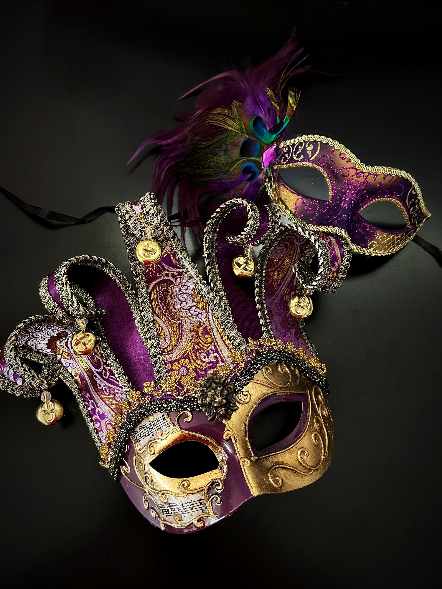 Purple and gold Venetian couples masquerade mask set with jester mask and peacock feather mask for Mardi Gras, Halloween, or masquerade ball.