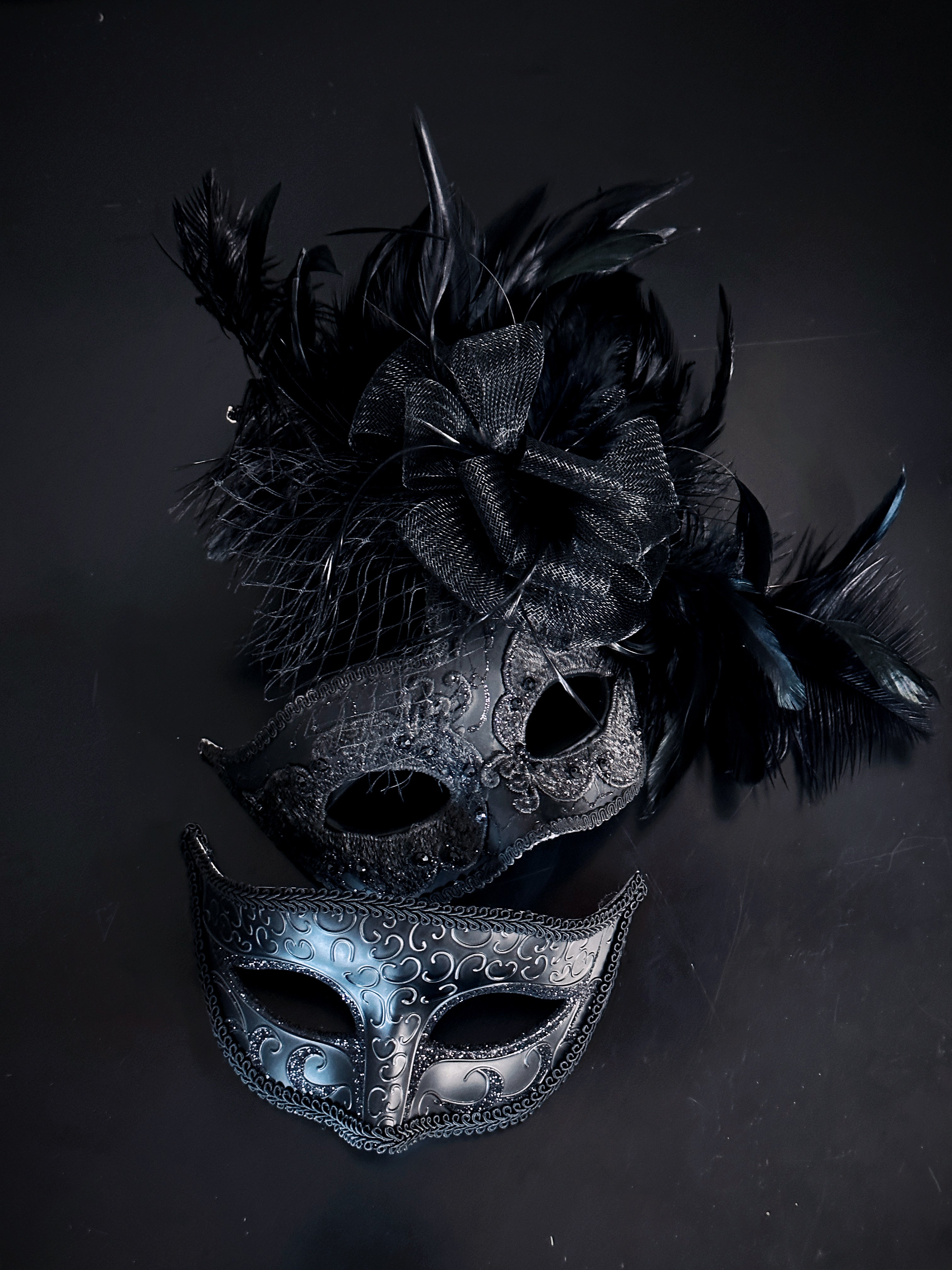 Couples masquerade mask with feathers in black for sale.