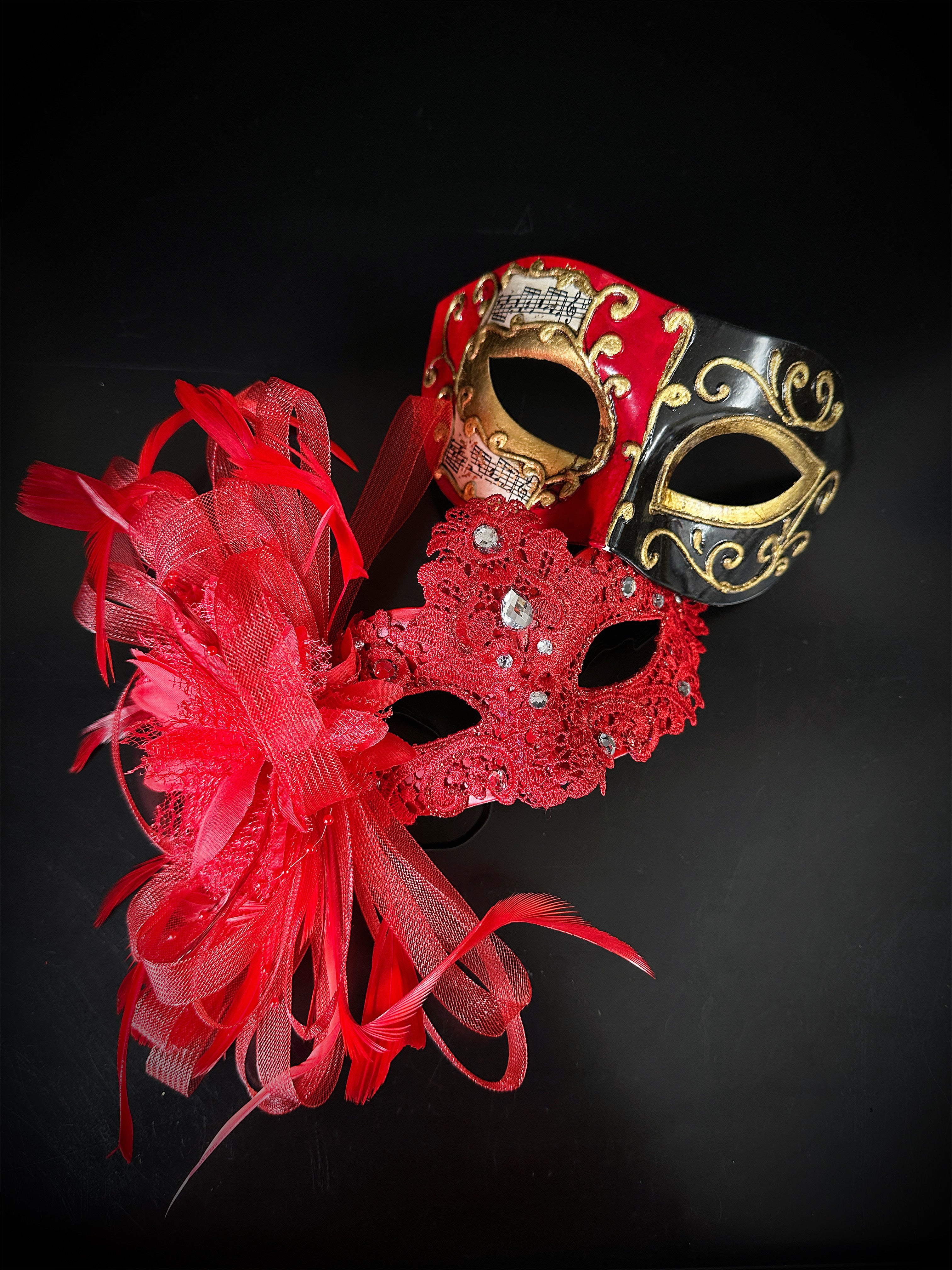 Couples masquerade mask set in red.