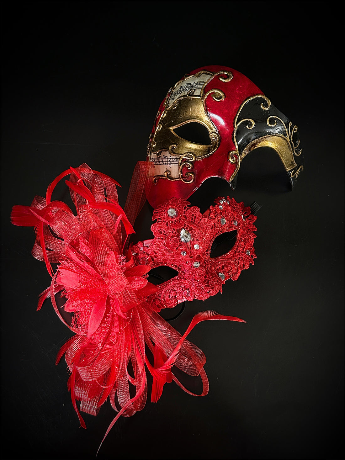 Couples masquerade mask set in red.