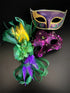 Couples masquerade masks in gold purple and green for mardi gras.