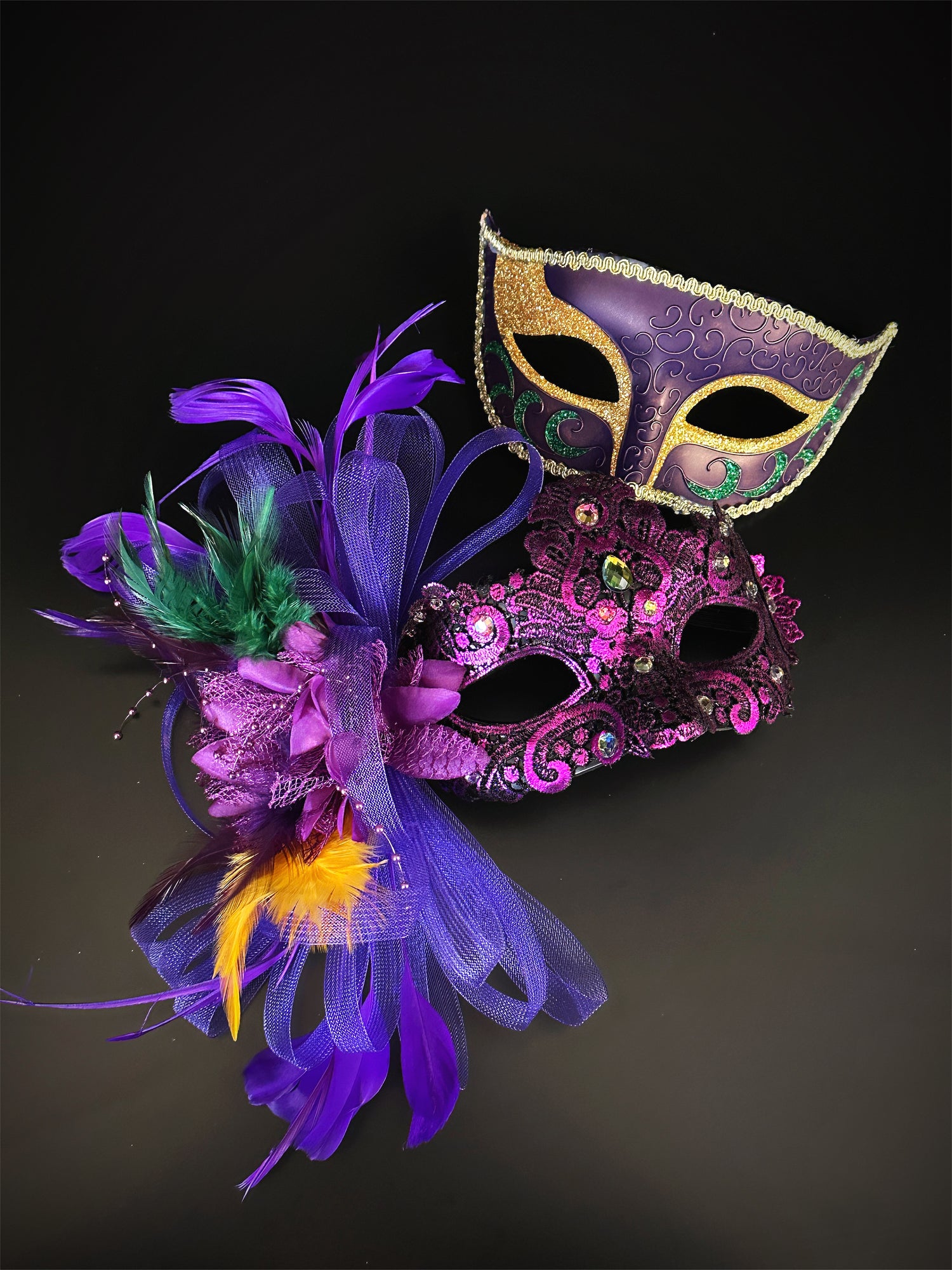Couples masquerade masks in purple, green, and gold.