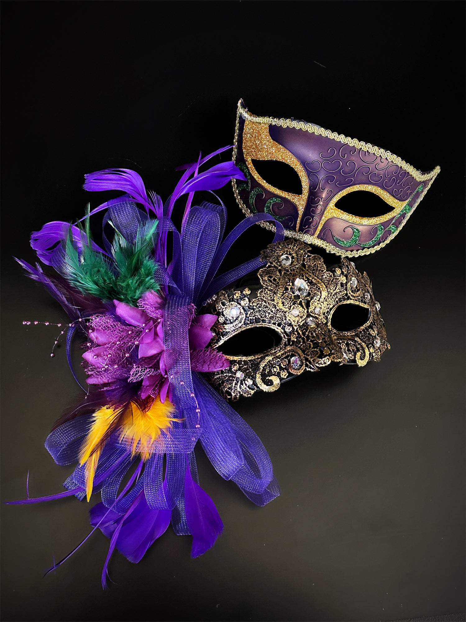 Couples masquerade masks in gold, purple, and green.