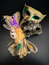 Couples masquerade masks in gold, purple, and green.