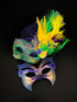 Couples masquerade masks in green, gold, and purple. The women&