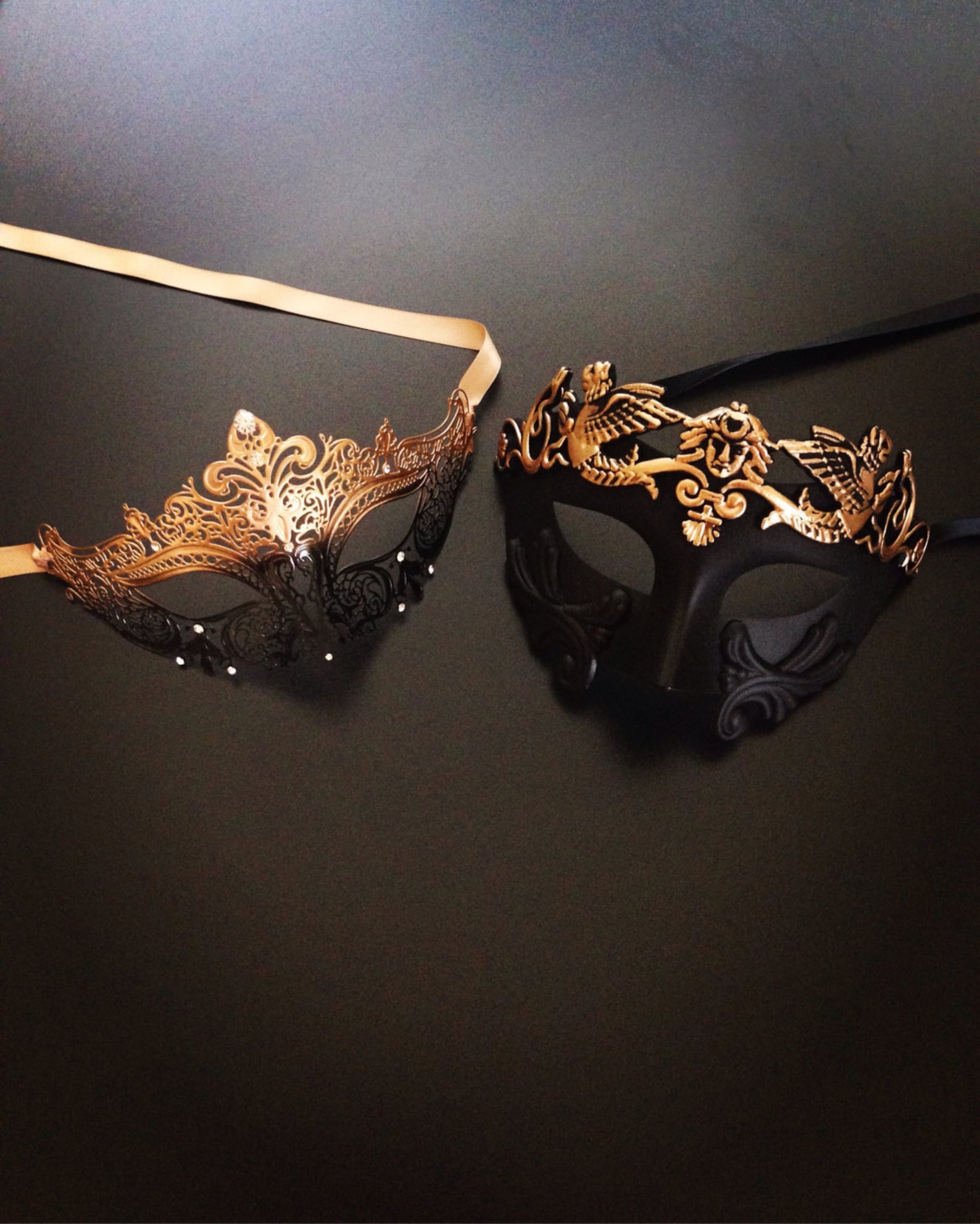 Couples masquerade masks in venetian style in gold and black for sale.