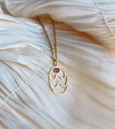 gold aquarius zodiac pendant necklace with red gemstone