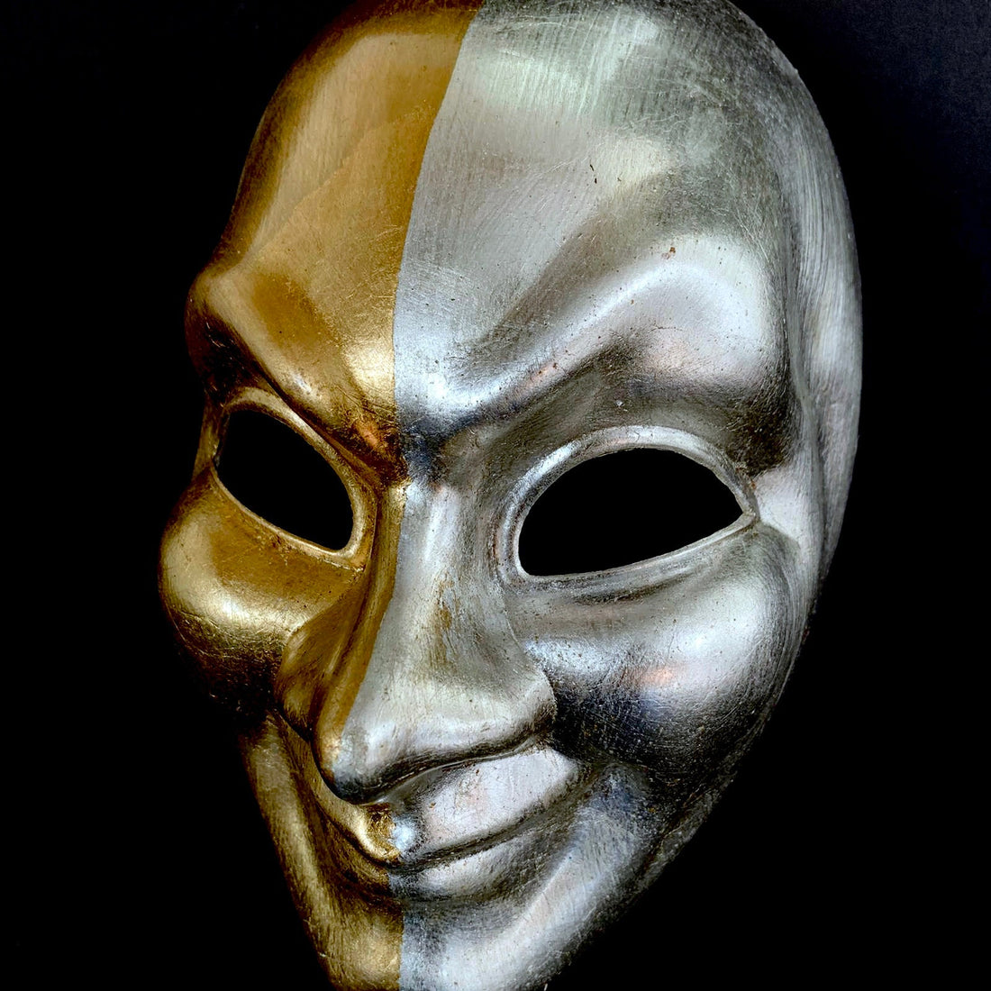 Comedy Venetian full face masquerade mask in a split color of gold and silver