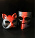 Red and black dual-style masquerade mask set with fox and modern face designs for theatrical events.