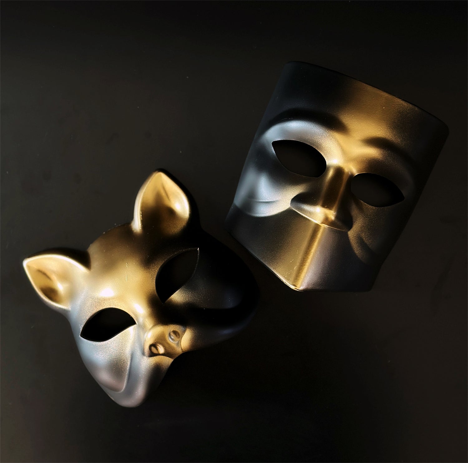 Gold and black masquerade cat mask and Bauta mask set for formal costume events.