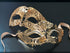 Gold couples masquerade masks with rhinestones and filigree lace cut-outs on black background