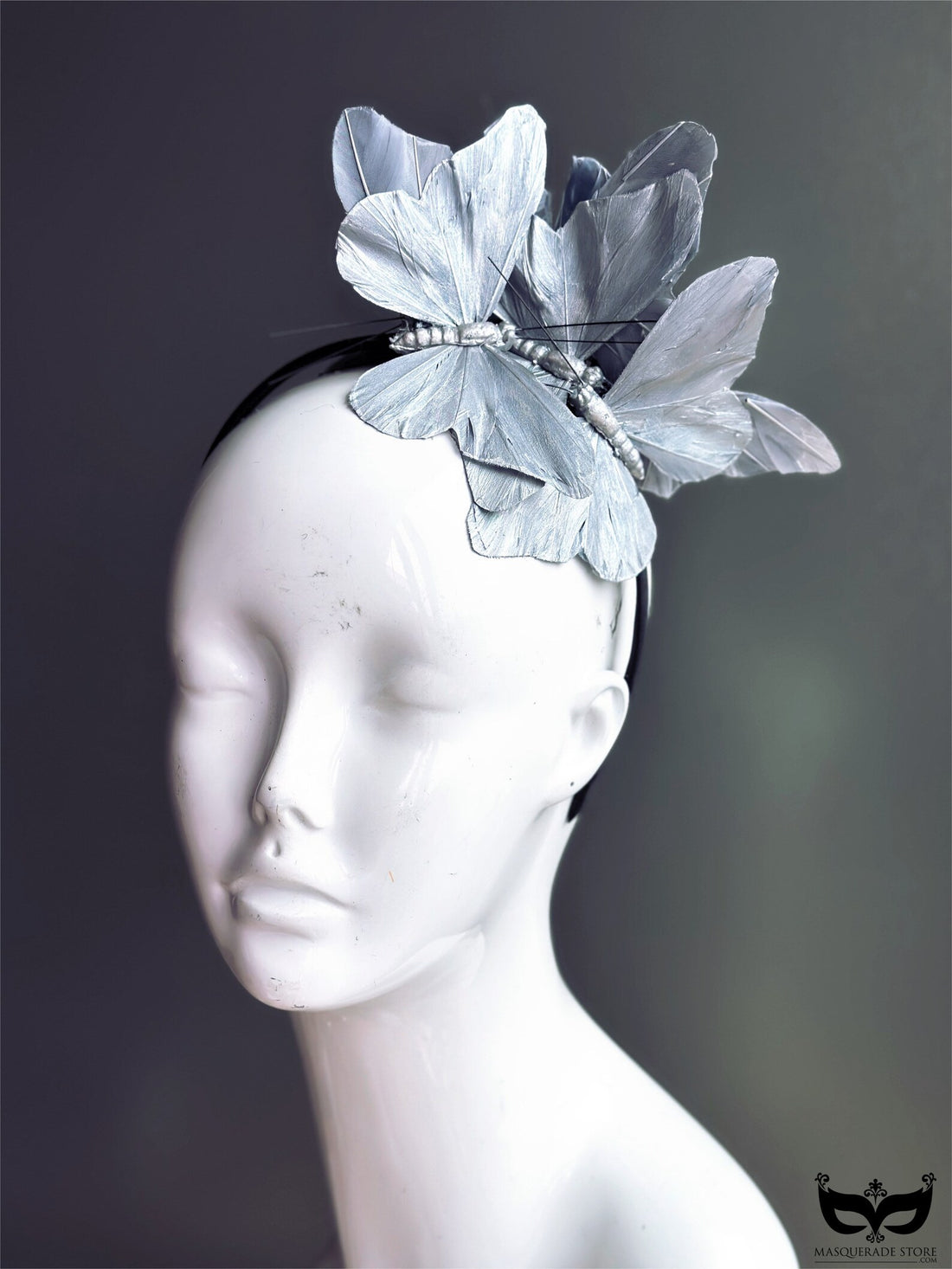 Silver butterflies on a black headband.