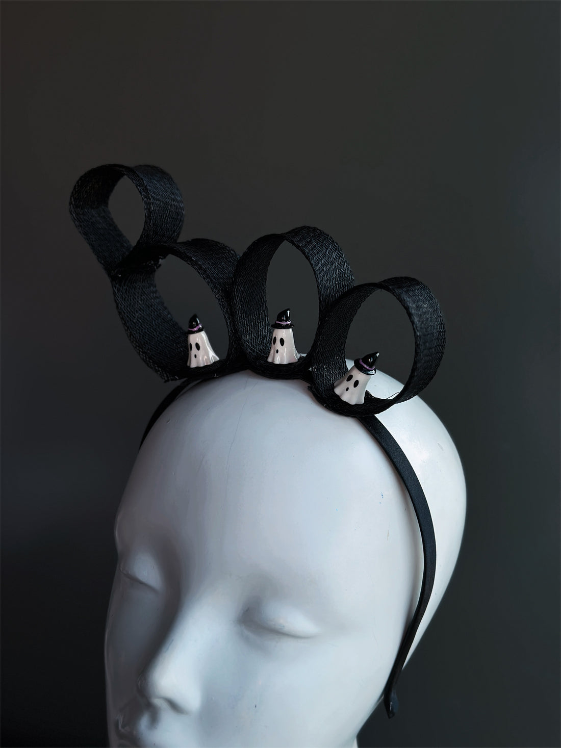 Halloween ghost fascinator hat with black ribbon loops and mini ghost accents.