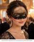 Gilded Shadow black and gold lace-style masquerade mask with floral scroll detailing and elegant formal styling.