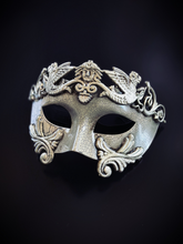 Silver gladiator-style masquerade mask with classical detailing and armor-inspired accents for prom or masquerade events.