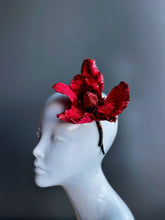 Red masquerade fascinator with shimmering magnolia bloom for Christmas masquerades, proms, or festive costume galas.