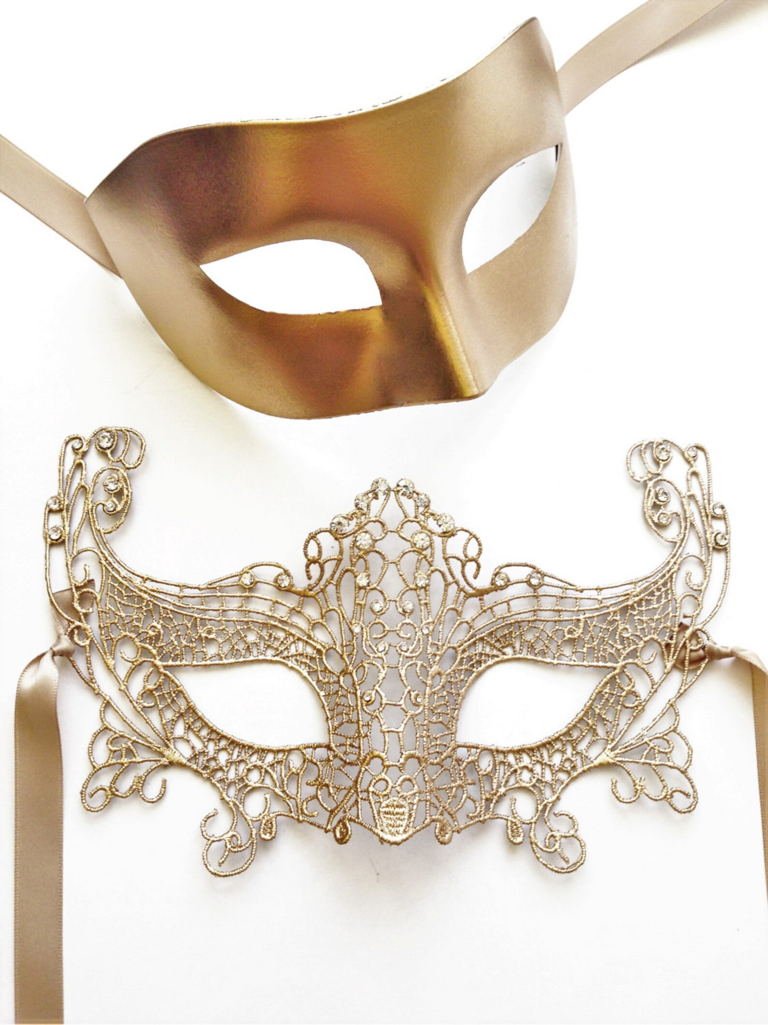 Gold masquerade couple’s mask set with a women’s lace filigree rhinestone mask and a men’s matte gold mask.