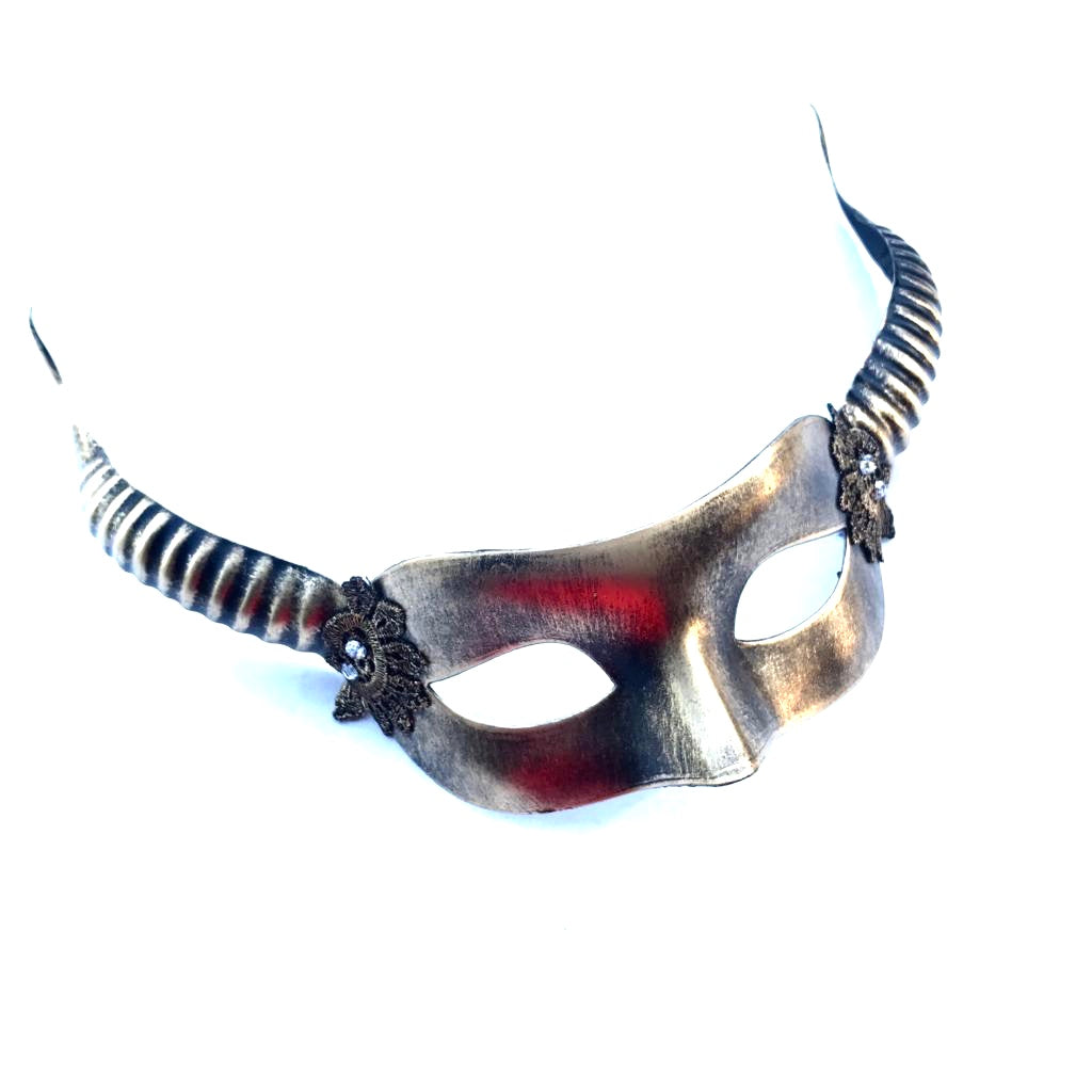 Fantasy masquerade mask with curved black and bronze horns and gold detailing