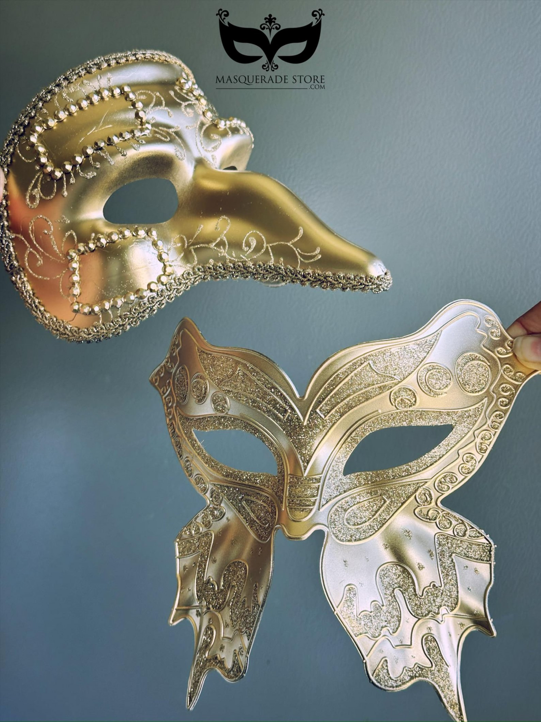 Gold Venetian couples masquerade mask set with men’s plague doctor mask and women’s butterfly filigree glitter mask.