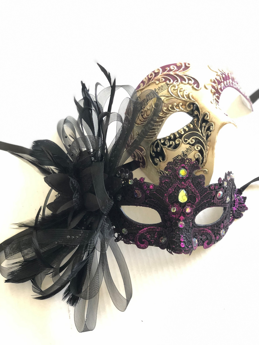 Gold and purple couples masquerade masks with lace, rhinestones, and feather accents.